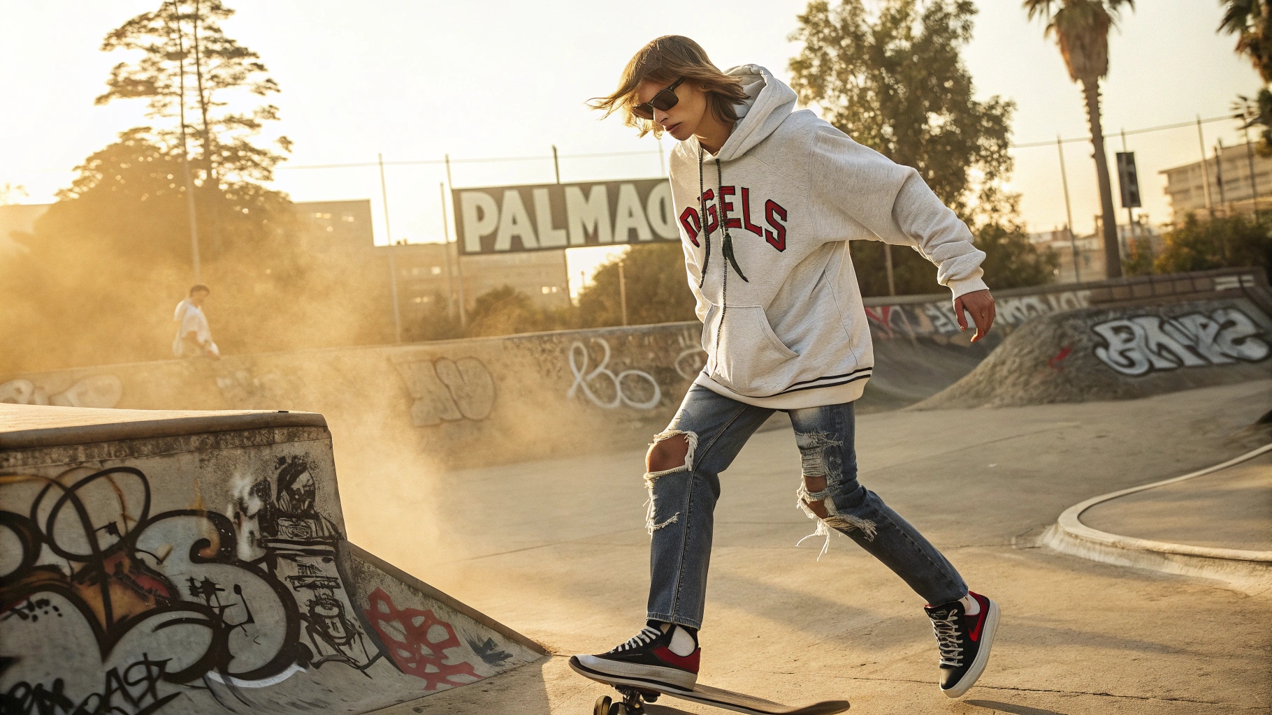 A skater wearing a Palm Angels-inspired oversized hoodie with gothic lettering, distressed baggy jeans, and high-top sneakers, captured mid-kickflip at a Los Angeles skatepark during golden hour, with graffiti-covered ramps and dust particles in warm sunlight adding depth.