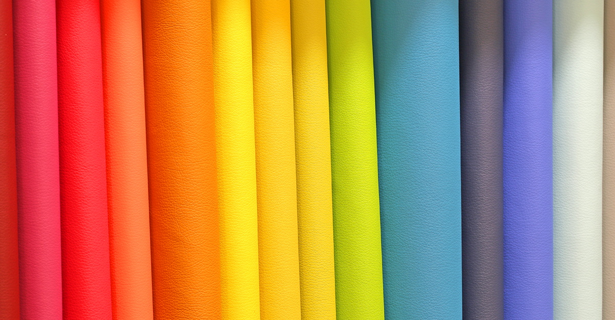 Colorful fabrics of many bright and vivid colors for sale in the